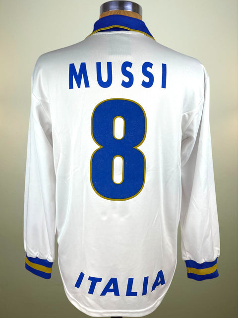 White Nike Italy 1996 jersey with 'MUSSI' and number '8', featuring 'ITALIA' text, on a mannequin against a neutral background.