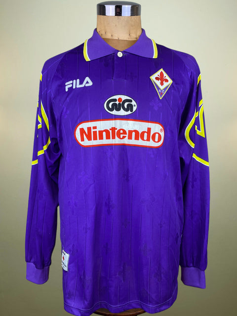 Purple Fiorentina 1997-98 Home jersey with Sponsored by Nintendo and made by Fila on a mannequin against a neutral background