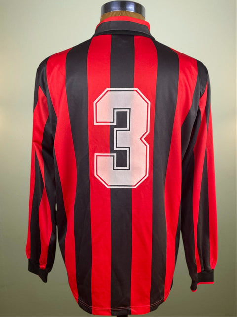 Red and black striped AC Milan Paolo Maldini jersey with number 3 on a neutral background