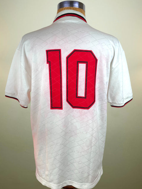 White AC Milan 1993-94 Away jersey with red number 10 on a mannequin against a plain background