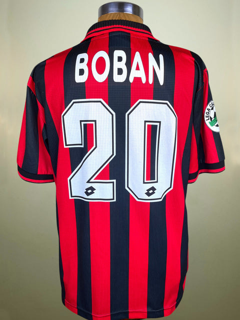 Red and black striped sports jersey with 'BOBAN' and number '20' on a mannequin against a beige background