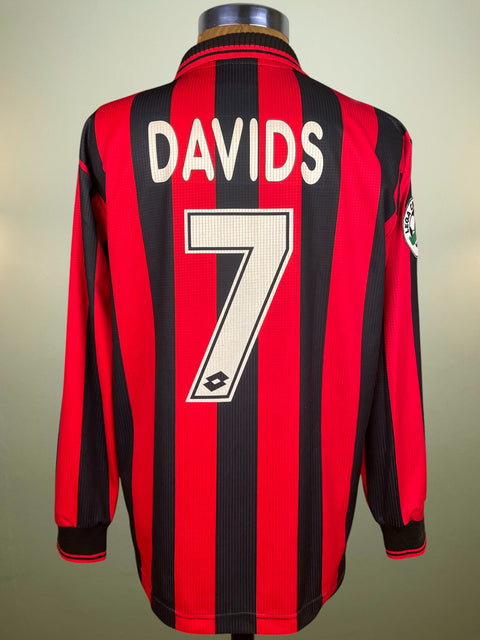 Red and black striped AC Milan 1997-98 jersey with 'DAVIDS' and number '7' on a plain background