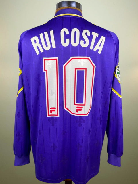 A purple match worn Fiorentina 97-98 football jersey with the name 'Rui Costa' and the number '10' printed on the back.