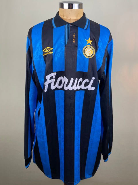 A navy blue and white striped Inter Milan 1993-94 match worn soccer jersey featuring the Inter Milan logo and the name 'Dennis Bergkamp' on the back.