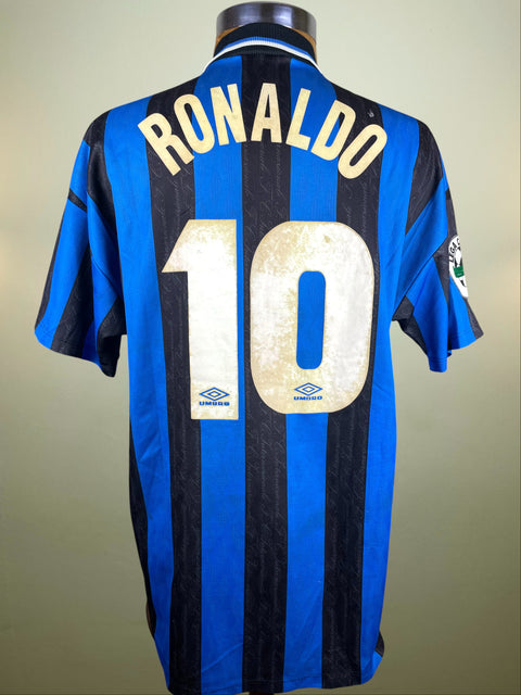 Blue and black striped Inter Milan 1997-98 jersey with 'RONALDO' and number '10' on a plain background