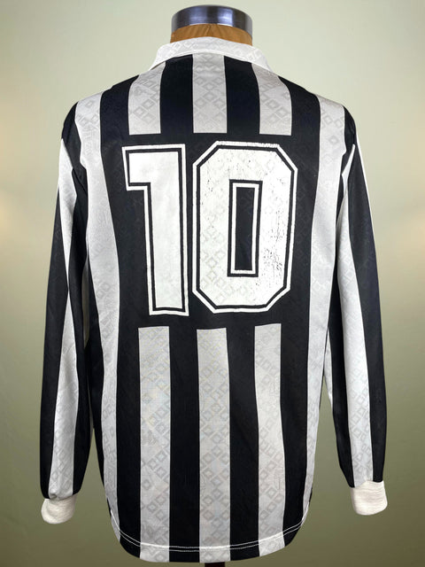 Black and white striped Juventus 1990-91 with number 10 on a mannequin against a neutral background