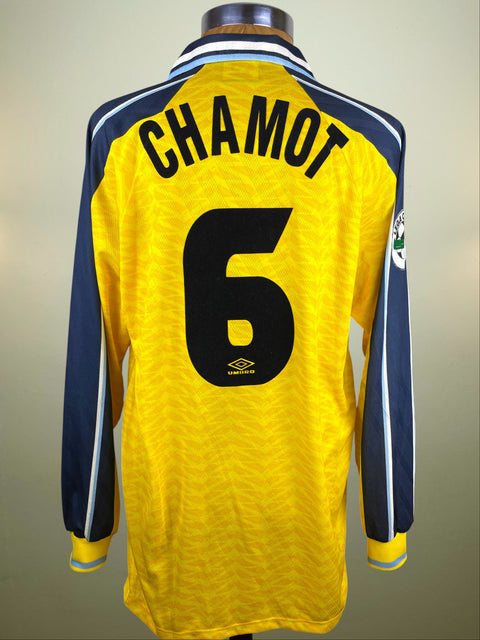 Yellow Lazio Away jersey with 'CHAMOT' and number '6' on a plain background