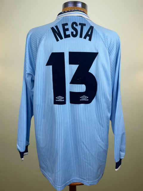 Match worn light blue long sleeve Lazio home shirt from the 1997-98 season worn by Alessandro Nesta with name and number 13 in black flock across the front of the shirt. Made by Umbro.