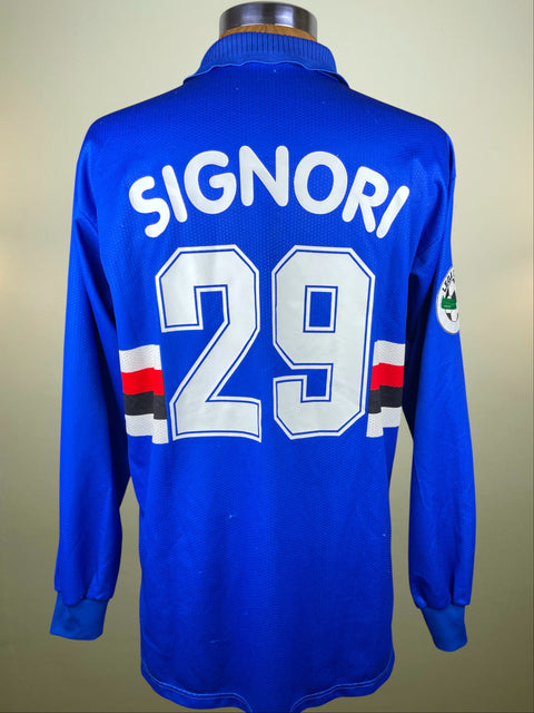 Blue Sampdoria 1997 jersey with 'SIGNORI' and number '29' on a beige background
