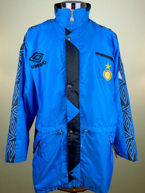 Blue Inter Milan Bench with black accents and Umbro logo on a mannequin against a beige background