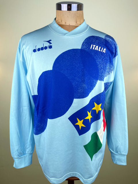 Light blue Italy Training jersey with Italian design on a mannequin against a beige background