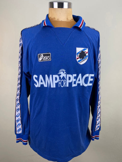Blue Sampdoria jersey with 'Samp for Peace' text on a mannequin against a gray background