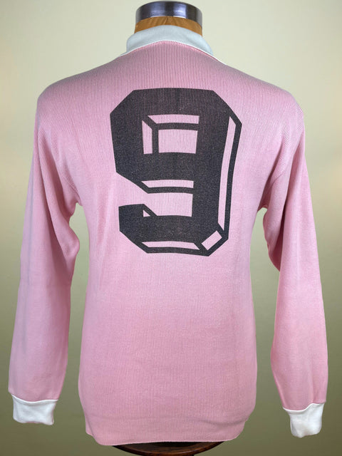 Pink Kappa Juventus Centenary long-sleeve shirt from 1987 with a large black number 9 on the back, displayed on a mannequin against a beige background.