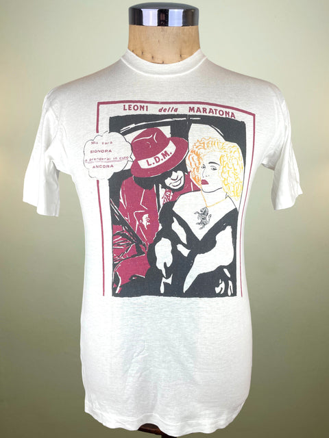 White t-shirt with graphic design on a mannequin against a neutral background