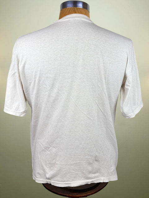 A white short-sleeve t-shirt displayed on a wooden dress form mannequin, showing the back view against a light beige background.