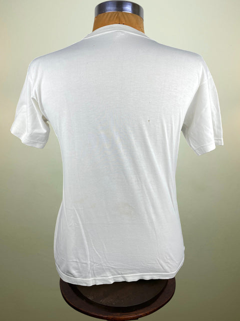 White t-shirt on a mannequin against a plain background
