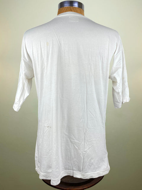 White shirt on a mannequin against a beige background