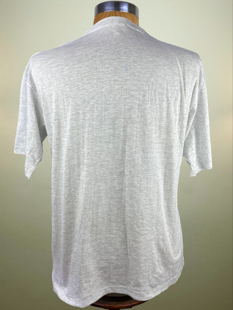 White t-shirt on a mannequin with a plain background