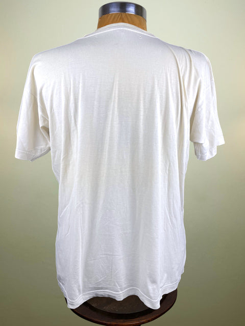 White t-shirt on a mannequin against a plain background