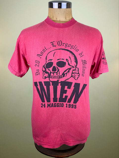 Red t-shirt with skull design and Vienna 24 May 1995 text on a mannequin against a beige background