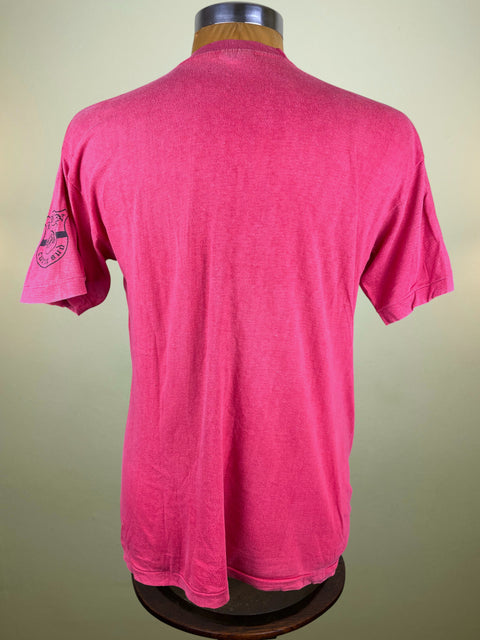 Red t-shirt on a mannequin with a plain background