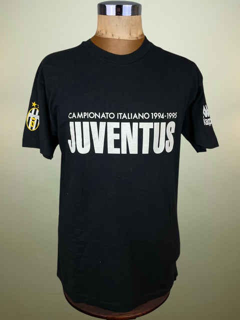 Black Juventus t-shirt on a mannequin with a beige background