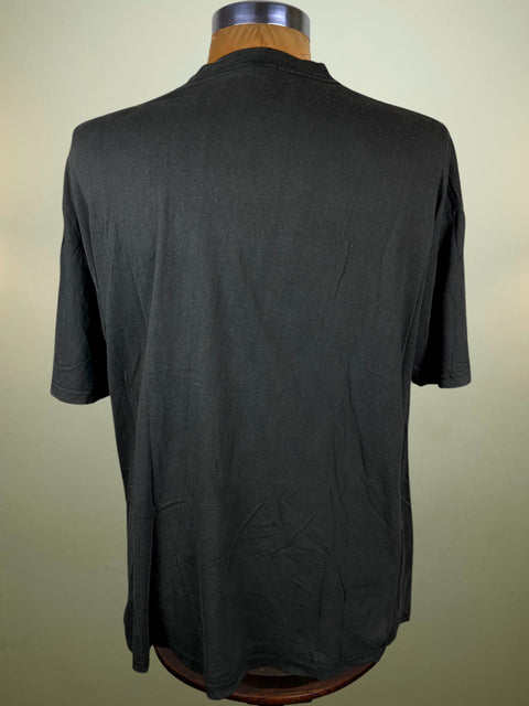 Black t-shirt on a mannequin against a plain background