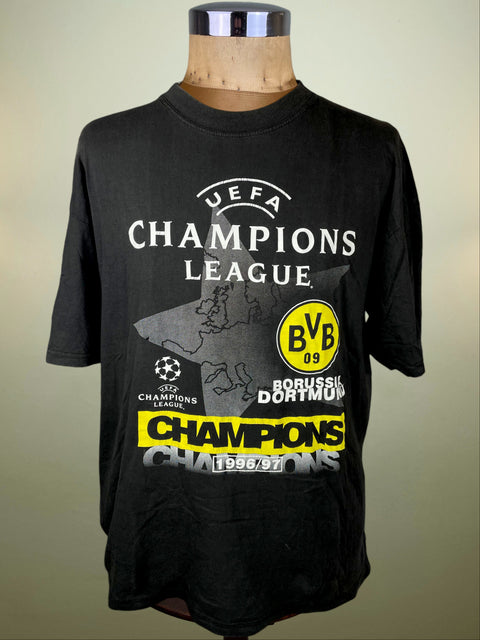 Black t-shirt with UEFA Champions League and Borussia Dortmund branding on a mannequin.