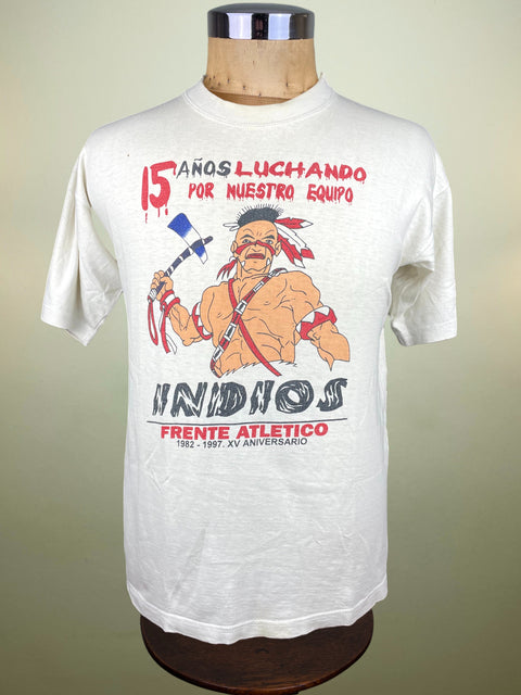 White t-shirt with graphic design on a mannequin against a beige background