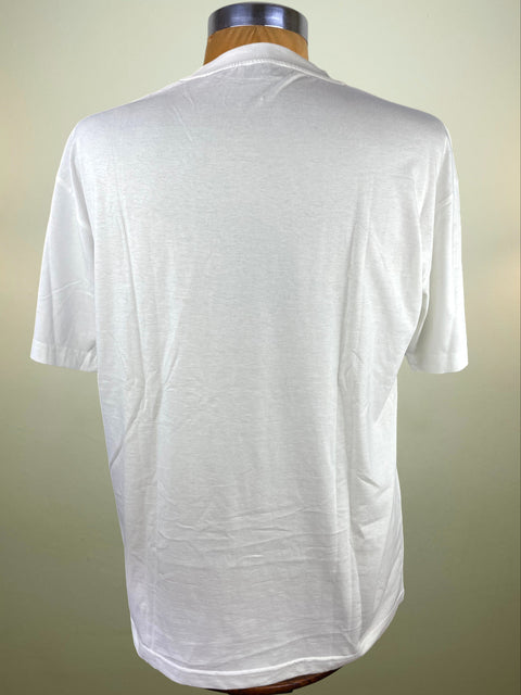 White t-shirt on a mannequin against a beige background