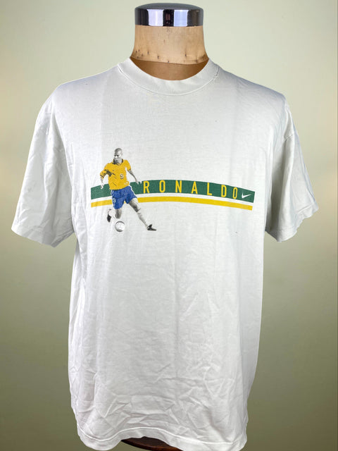 White t-shirt with a graphic of a soccer player and 'Ronaldo' text on a mannequin against a beige background