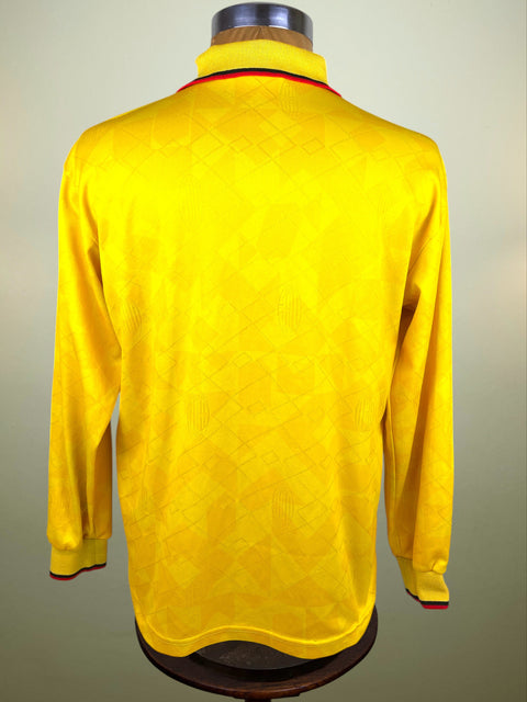 Yellow AC Milan Super Cup Final jersey on a mannequin against a plain background
