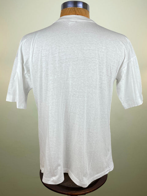 White t-shirt on a mannequin against a beige background