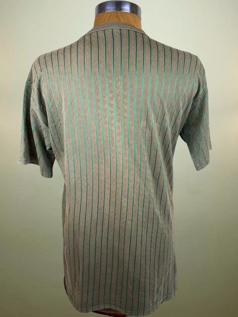 Striped shirt on a mannequin against a plain background