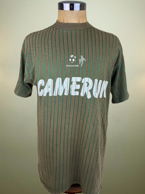 Green pinstripe shirt with 'Camerun' text on a mannequin against a beige background