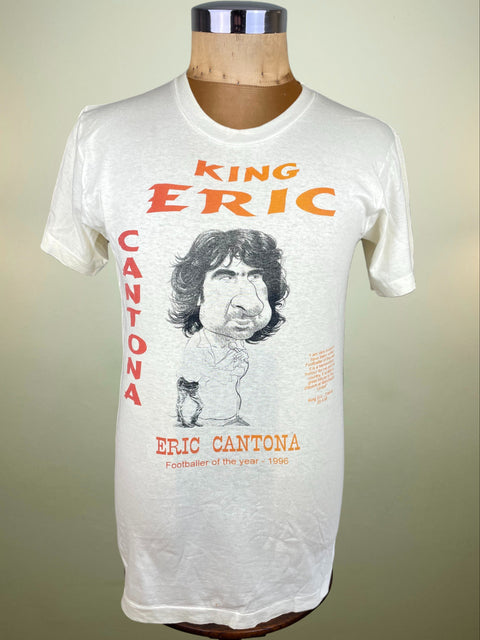 White t-shirt with 'King Eric Cantona' graphic on a mannequin against a beige background