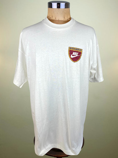 White t-shirt with a Nike logo on a mannequin against a plain background