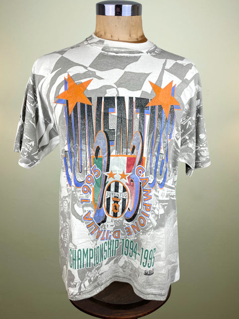 Gray t-shirt with colorful Juventus graphics on a mannequin against a neutral background