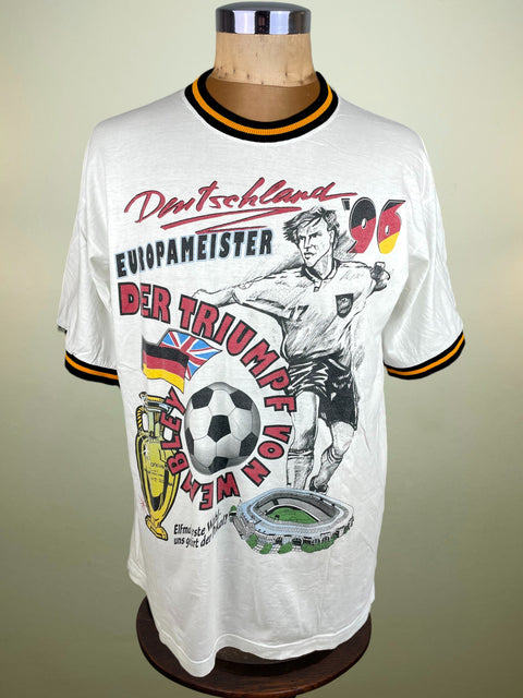 Vintage soccer jersey with German design on a mannequin against a plain background