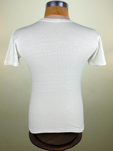 White t-shirt on a mannequin against a plain background