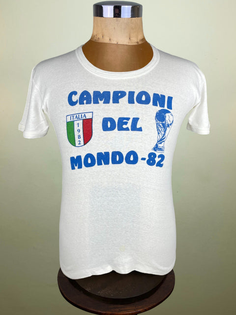 White t-shirt with Italian text and graphics on a mannequin against a beige background