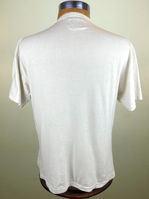 White t-shirt on a mannequin against a plain background