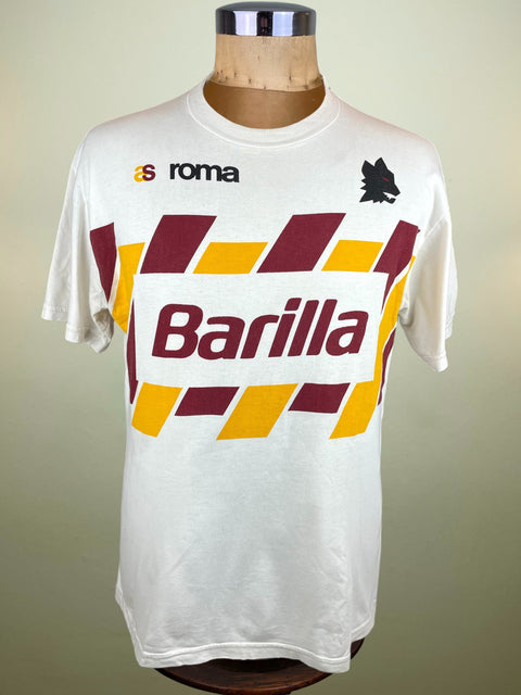 White AS Roma t-shirt with Barilla logo on a mannequin against a beige background