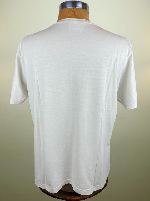 White t-shirt on a mannequin against a plain background