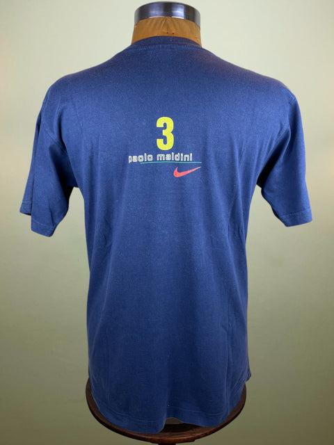 Blue Nike t-shirt with number 3 and 'Paolo Maldini' on a mannequin against a beige background