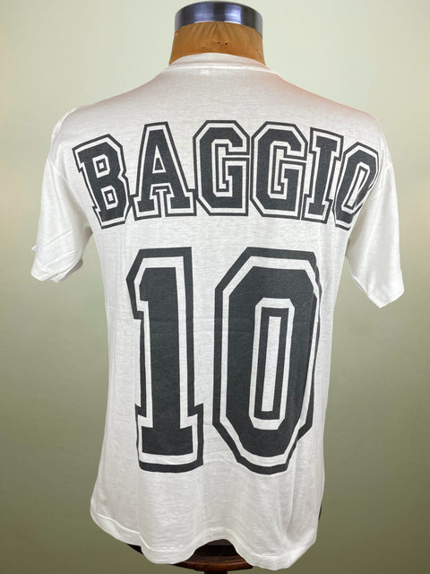 White t-shirt with 'BAGGIO' and number '10' on a mannequin against a beige background