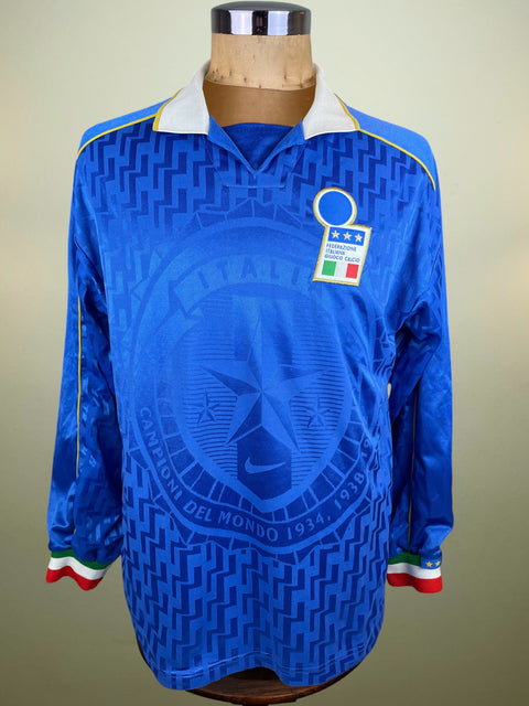 Blue Nike Italia jersey match worn by Casiraghi with a logo on a mannequin against a beige background