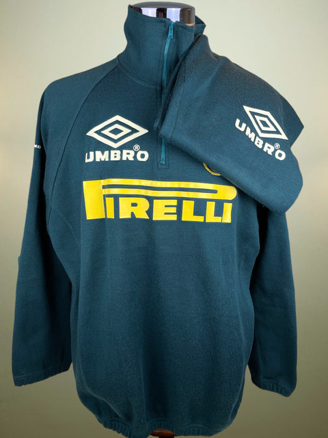Teal Inter Milan Training Jacket with Umbro and Pirelli logos on a neutral background