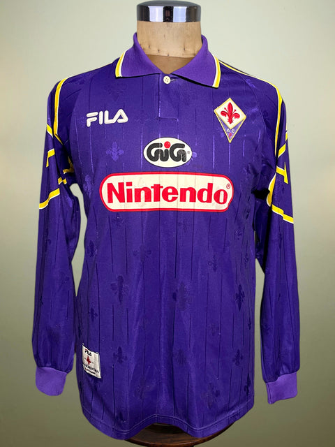 Purple Fiorentina 1997-98 jersey with Fila branding and Nintendo Sponsor on a mannequin against a neutral background