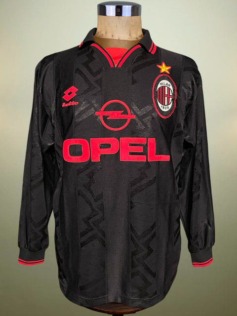 Black AC Milan 1996-97 Shirt with red accents and Opel logo on a mannequin against a neutral background